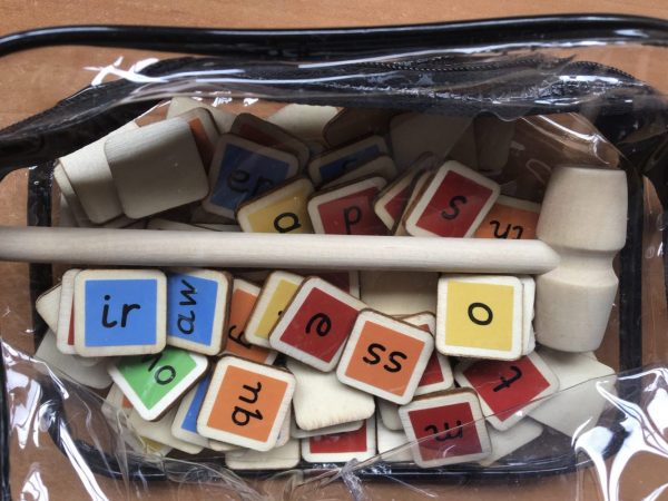This new toy can be used with our colour coded flash card book to: MAKE,  TAP and BLEND hundreds of words. It is fully systematic for phases 2-5 (approximately years reception to year 2). You will receive: 73 colour mapped wooden tiles and a small wooden hammer in a zip up bag. 