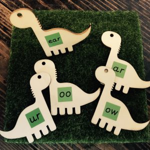 wooden dinosaur toy, phonics letters and sounds